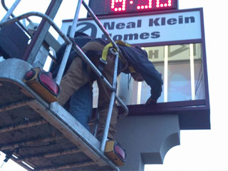 The crew installing the directory sign